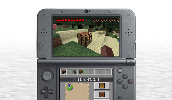Imagen de ejemplo donde vemos una New Nintendo 3DS, con sus dos pantallas, ejecutando el juego de Minecraft.