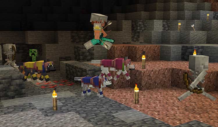 Imagen donde podemos ver un jugador y sus lobos domesticados, con armadura, explorando una cueva y luchando contra esqueletos.